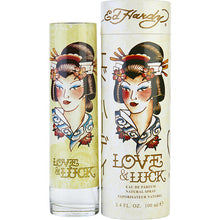 Load image into Gallery viewer, Love &amp; Luck Perfume by Christian Audigier, Hip, trendy women need a perfume that captures their modern attitudes. That is precisely what you get with Love &amp; Luck. The image on the bottle draws inspiration from Ed Hardy’s tattoo work.  Notes:  The top notes in this fragrance include vodka, blood orange, and bergamot. The heart brings forward scents of plum, nectarine, black currant, jasmine, and pink pepper. The base consists of patchouli, cedar, musk, and sandalwood. This came out in 2008