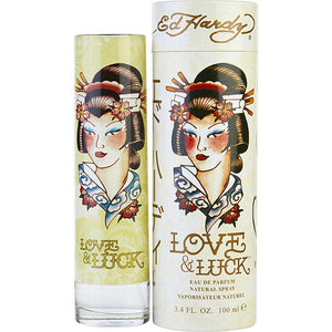 Love & Luck Perfume by Christian Audigier, Hip, trendy women need a perfume that captures their modern attitudes. That is precisely what you get with Love & Luck. The image on the bottle draws inspiration from Ed Hardy’s tattoo work.  Notes:  The top notes in this fragrance include vodka, blood orange, and bergamot. The heart brings forward scents of plum, nectarine, black currant, jasmine, and pink pepper. The base consists of patchouli, cedar, musk, and sandalwood. This came out in 2008