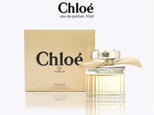 Load image into Gallery viewer, A casual but mature and evocative scent, Chloe New perfume for women is a seductive fragrance with a moderate, flowery tone.  Notes:  First introduced by Chloe in 2007, this perfume has a thoughtful and complex construction that blends notes of rose and magnolia with amber, lily of the valley and a cedar wood base.  Style:  This engaging and elegant fragrance is wonderful for a broad variety of adventures, from a picnic in the park to a coffee date with a friend.