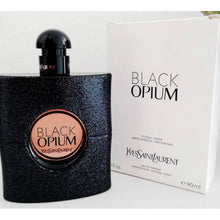 Load image into Gallery viewer, Black Opium Perfume by Yves Saint Laurent, Black Opium is an Oriental vanilla women’s fragrance with vanilla, coffee, and sweet main accords. Launched in 2014, this scent was a collaboration between perfumers Nathalie Lorson, Marie Salamagne, Olivier Cresp, and Honorine Blanc.  Notes: It is housed in a dark bottle with sequin decorations to present a glam rock look. Pear, pink pepper, and orange blossom make up the head notes while coffee, jasmine, 