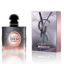 Load image into Gallery viewer, Black Opium Floral Shock Perfume by Yves Saint Laurent, Released in 2017, Black Opium Floral Shock is a women’s floral fruity gourmand fragrance with white floral, citrus, and fruity main accords. Its flacon is the same dark and square shape of the original Black Opium perfume, but has fading black sparkles that reveal pink.  Notes: The top notes are bergamot, lemon, pear, and freesia. In the middle are gardenia, orange blossom, white flowers, and solar notes.