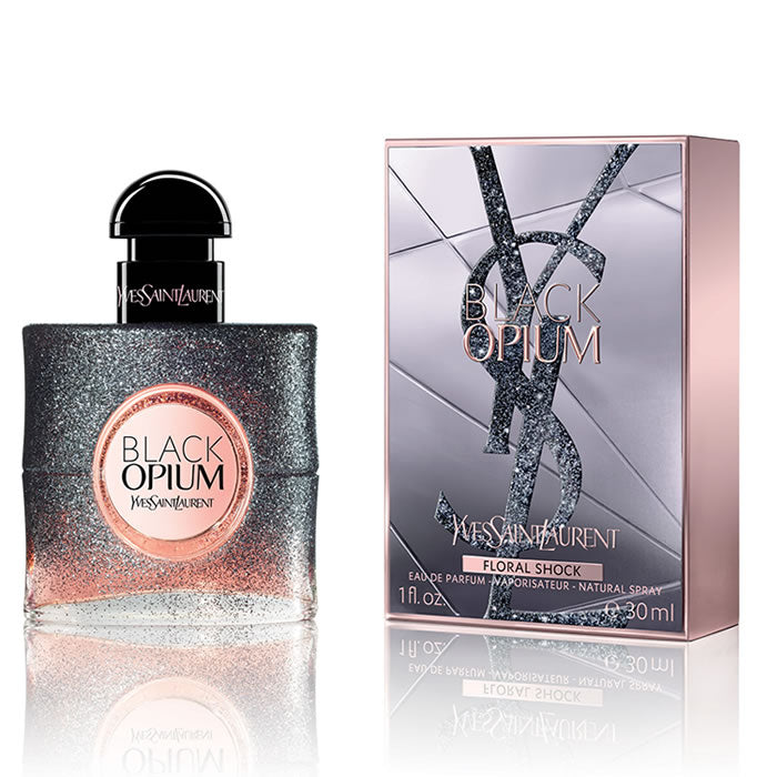 Black Opium Floral Shock Perfume by Yves Saint Laurent, Released in 2017, Black Opium Floral Shock is a women’s floral fruity gourmand fragrance with white floral, citrus, and fruity main accords. Its flacon is the same dark and square shape of the original Black Opium perfume, but has fading black sparkles that reveal pink.  Notes: The top notes are bergamot, lemon, pear, and freesia. In the middle are gardenia, orange blossom, white flowers, and solar notes.