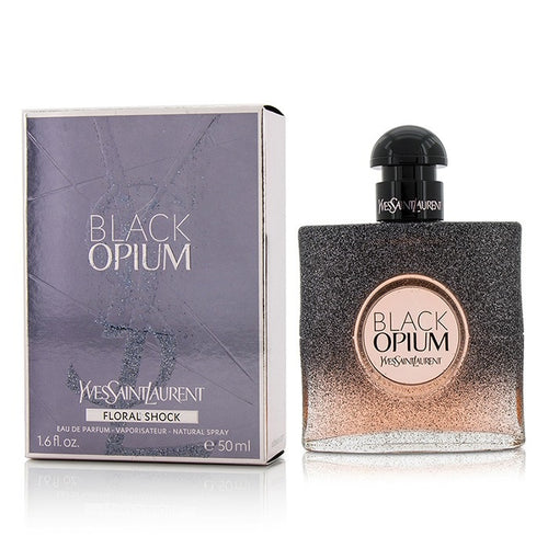 Black Opium Floral Shock Perfume by Yves Saint Laurent, Released in 2017, Black Opium Floral Shock is a women’s floral fruity gourmand fragrance with white floral, citrus, and fruity main accords. Its flacon is the same dark and square shape of the original Black Opium perfume, but has fading black sparkles that reveal pink.  Notes: The top notes are bergamot, lemon, pear, and freesia. In the middle are gardenia, orange blossom, white flowers, and solar notes.