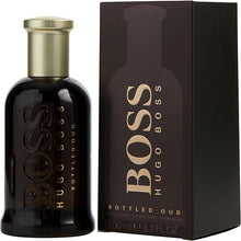 Load image into Gallery viewer, Boss Bottled Oud Cologne by Hugo Boss, Become the epitome of opulence and charm with Boss Bottled Oud, an enigmatic men’s fragrance. This intoxicating blend full of spicy and woody accords is a showstopper of a scent, fit for any occasion.  Notes:  Top notes of crisp apple and various citruses opens the cologne with a powerful burst of refreshment and energy that awakens the senses.