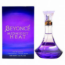 Load image into Gallery viewer, ﻿Beyonce launches the latest, more sensual than the previous one Midnight Heat. Midnight Heat exudes passion in the air and embodies excitement of hot summer nights. Notes: Top notes are delicious, fruity flavors of Star Fruit and Plum which gradually lead to notes of Orchid, Purple Peony and Black Tulips at the heart. The woody base exudes warmth with notes of Sandalwood, Amber and Patchouli.