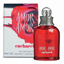 Load image into Gallery viewer, Amor Amor by Cacharel Perfume. Discover a women&#39;s fragrance as romantic as first love . A 2003 release by French fashion and fragrance brand Cacharel, Amor Amor exudes passion and youthful exuberance.  Notes:  Exotic floral essences and crisp citrus notes star in this feminine formula. Intoxicating and exotic Malati flower pairs with delicate lily-of-the-valley, while mandarin, blood orange and pink grapefruit add a lively cocktail of tart citrus.  Style: