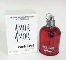 Load image into Gallery viewer, Amor Amor by Cacharel Perfume. Discover a women&#39;s fragrance as romantic as first love . A 2003 release by French fashion and fragrance brand Cacharel, Amor Amor exudes passion and youthful exuberance.  Notes:  Exotic floral essences and crisp citrus notes star in this feminine formula. Intoxicating and exotic Malati flower pairs with delicate lily-of-the-valley, while mandarin, blood orange and pink grapefruit add a lively cocktail of tart citrus.  Style: